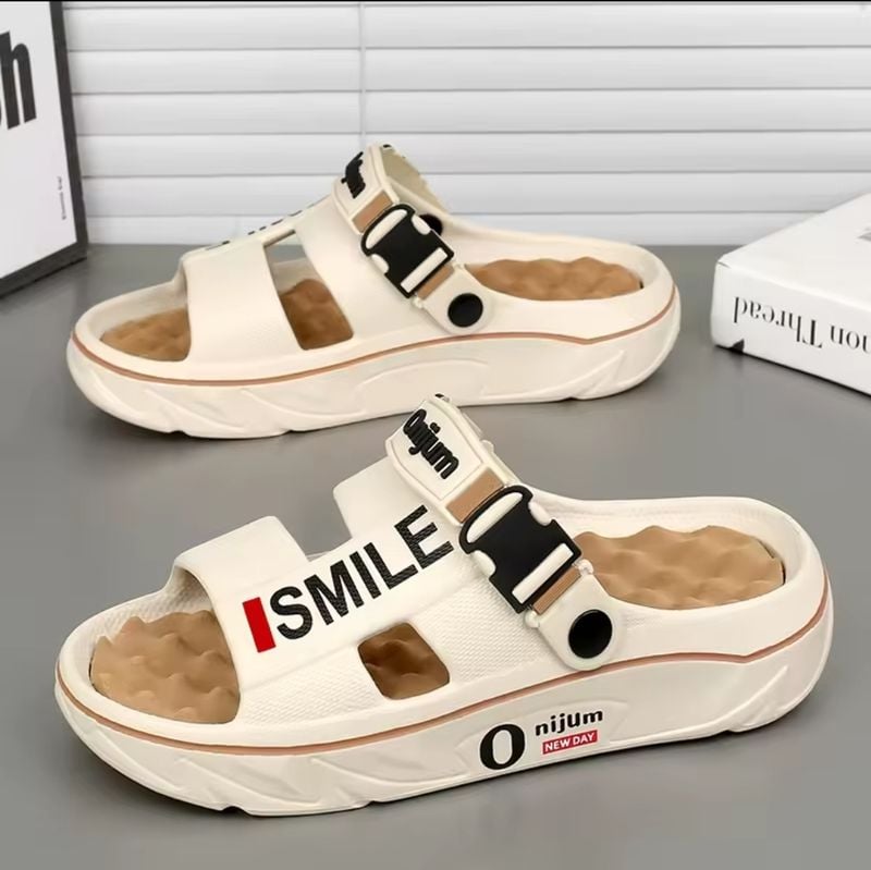 Experience ultimate comfort with Smile Comfort Massage Slides! Unisex EVA sandals with platform design, perfect for Jamaica's heat. Enjoy relaxing foot relief today!